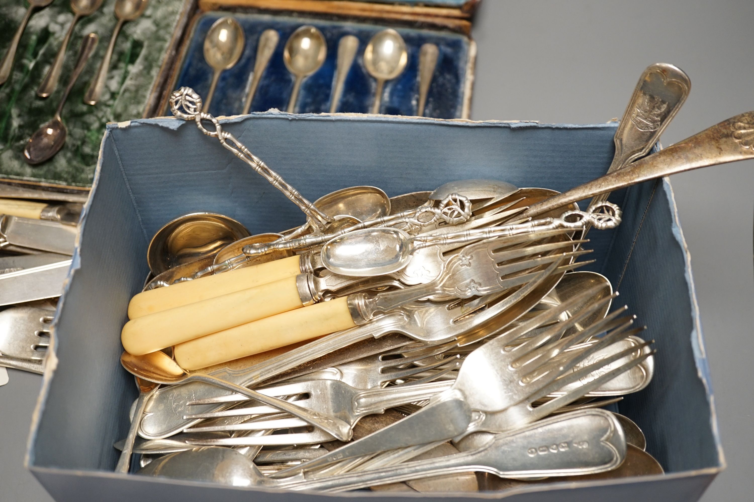 A quantity of 19th century and later assorted silver cutlery, including Edwardian basting spoon, various dates and makers, ten dessert eaters, a set of six Chinese white metal teaspoons by Wang Hing, two cased sets of si